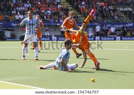 THE HAGUE, NETHERLANDS - JUNE 1: Dutch player de Wijn is tackeld by the Argentinian player Rossi during the Hockey World Cup in the match between The Netherlands and Argentina (men). NED beats ARG 3-0
