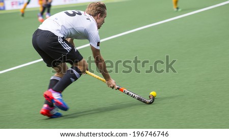 THE HAGUE, NETHERLANDS - JUNE 1: German player Butt is playing the ball during the Hockey World Cup 2014 in the match between Germany and South Africa. GER beats RSA  4-0