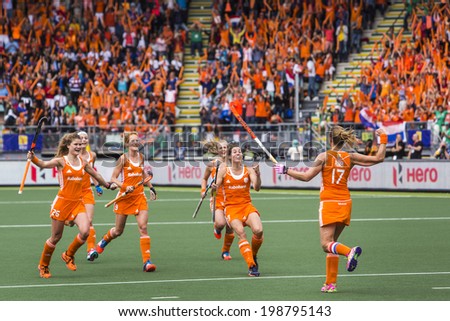 THE HAGUE, NETHERLANDS-JUNE 14,2014: Maartje Paumen (NED) runs back to cheer with her team after scoring 1-0 from a penalty push against Australia during the finals of the World Championships Hockey