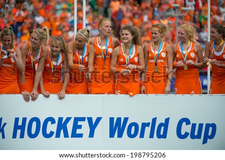 THE HAGUE, NETHERLANDS - JUNE 14: The Netherlands women field hockey team celebrates on the podium during the prize winning ceremony after beating Australia and becoming World Champions for 2014