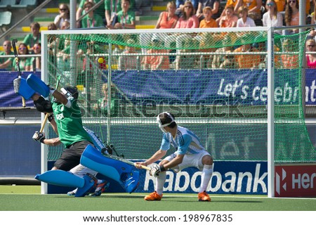 THE HAGUE, NETHERLANDS - JUNE 1. Netherlands scores from a penalty corner against Argentina (3-1) Goalie Juan Vivaldi cant stop the ball in the top left corner of the goal  in 2014