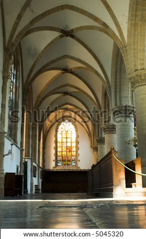 Light through a stained window inside the Bavo Protestant Church in Haarlem, the Netherlands