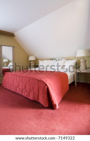 A luxury double bed in a warm