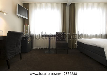 The interior of a stylish, business class hotel room, with all facilities available