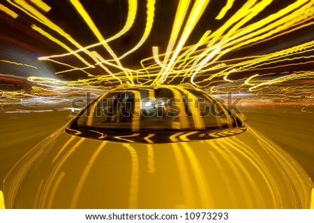 A car driving through the frantic traffic of a busy city during rush hour (Quadruple exposure)