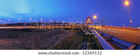 A panoramic view on a huge highway junction near Den Haag, the Netherlands at dusk