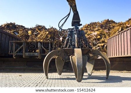 A huge mechanical claw, used to manipulate steel scrap on a scrapheap
