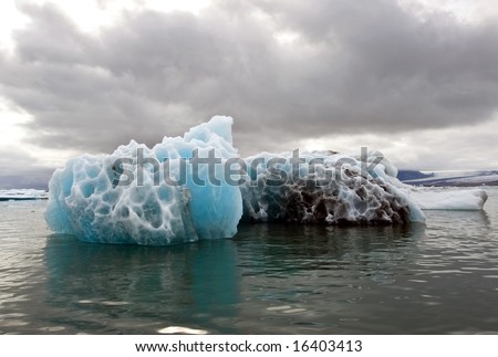A melting iceberg in the famous Jokulsarlon glacier lake in Iceland, where the icebergs, originating from the Vatnajokull float. This location was used for various action movies.