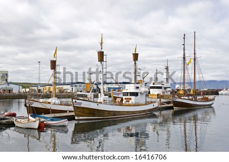 Boats, used to take tourists on whale watching trips wait for new passengers in Husavik, Iceland
