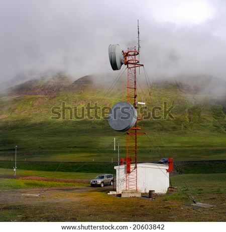 Moody Icelandic landscape with a communications station, illustrating global connectivity