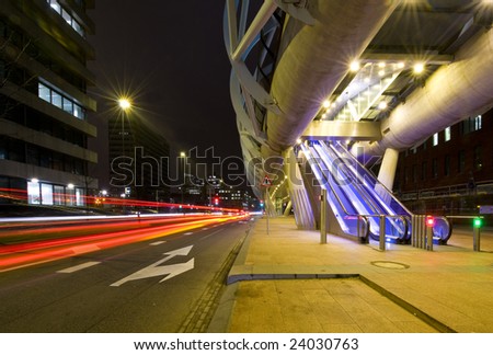 The modern looking, futuristic elevated tram line in the Hague, the Netherlands at night