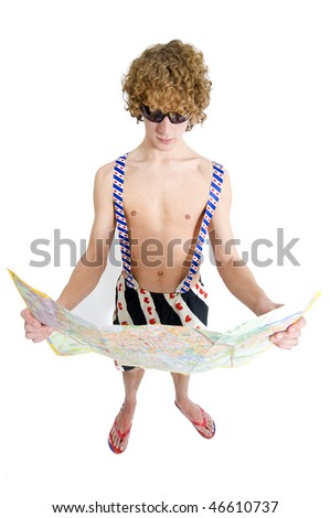 An archetypal tourists dressed in suspenders, swimming pants and slippers staring at a map to find his way