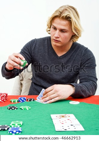 A Poker player deciding on how much to bet on his hand after the flop of a poker game