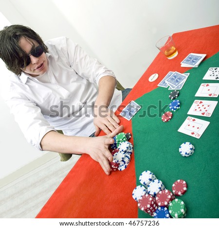A poker player going all in after the flop