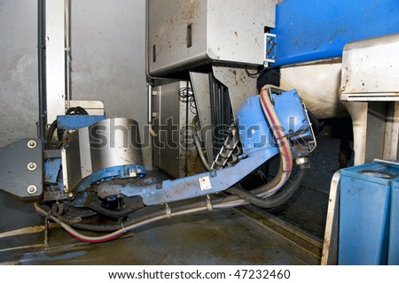stock photo A fully automated milking robot at a modern dairy farm