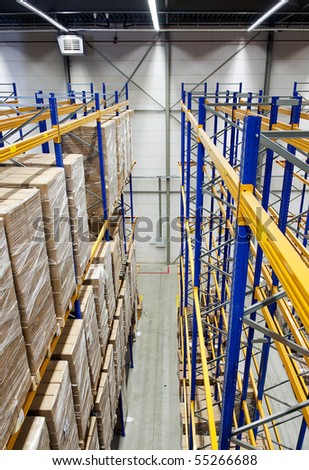 The racks and shelves of a huge warehouse seen from above
