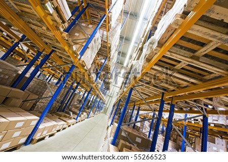Shelves, full of boxes in a huge warehouse, ready for transport to the customer