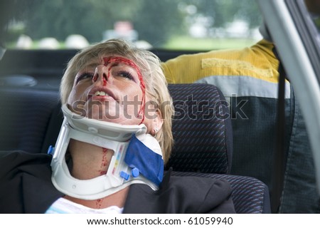 neck brace around a woman\'s neck to support her spinal cord after a severe car accident