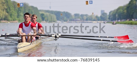 Oarsmen building up speed during a rowing race