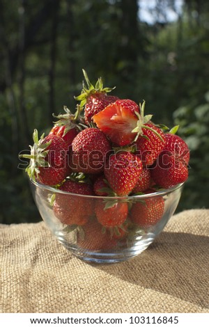 fresh ripe strawberry at glass bowl outdoor