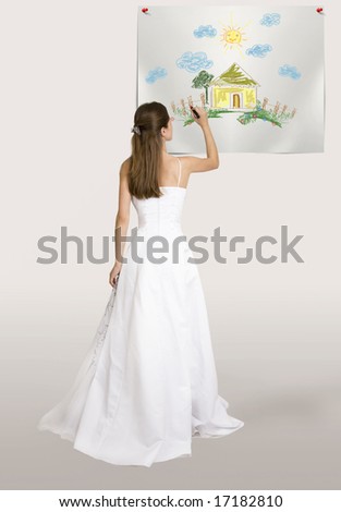 Bride drawing house on the wall This image can be used to represent any dreams and future plans after wedding event.
