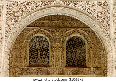 Moorish engraving on the facade at the Courtyard of the Mexuar inside the Alhambra, Granada, Spain.