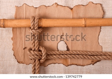 knot and old paper on the background of old cloth
