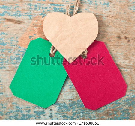 Valentine and the price tag label on wooden background
