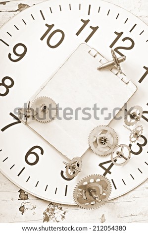 mechanical clock gears on the old wooden table