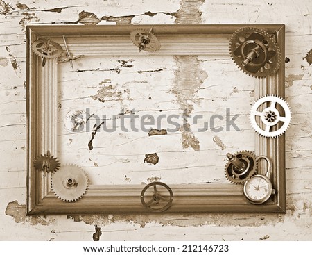 wooden frame and mechanical clock gears on the old wooden table