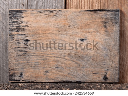 old wooden board inscriptions, announcements, old price tag on an old wooden background