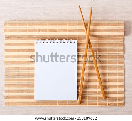 Sushi menu chopsticks for sushi on bamboo napkin