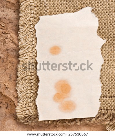old paper, the price tag on the background of old cloth and old paper