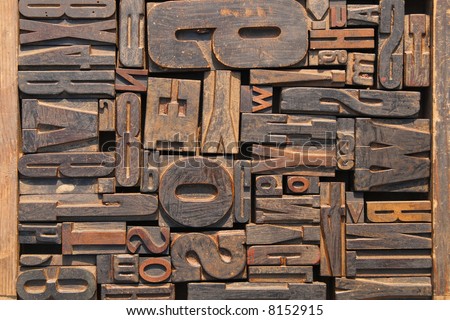 Box of old wooden printing blocks with different sized letters
