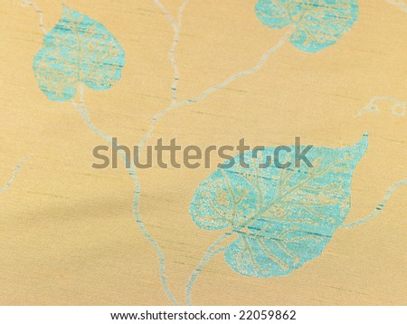 Three leaves on yellow background cloth