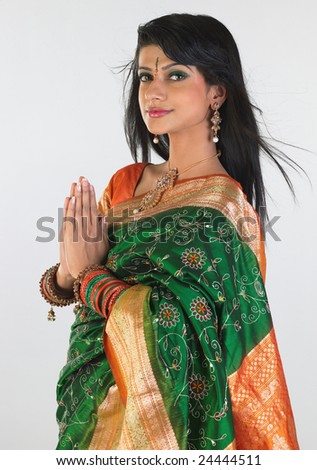 Woman in green sari in inviting posture