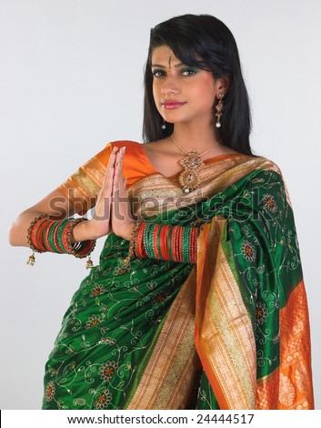Woman in sari with folded hands