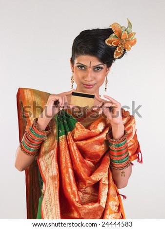 Woman in rich silk-sari with credit card