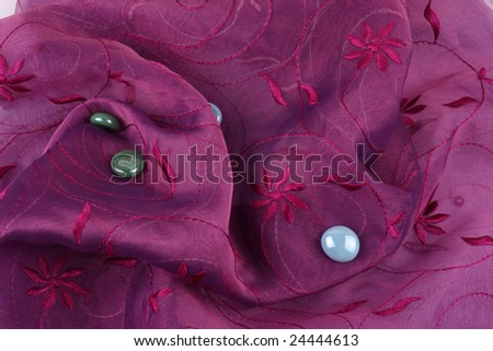 Pink floral background cloth with pebbles