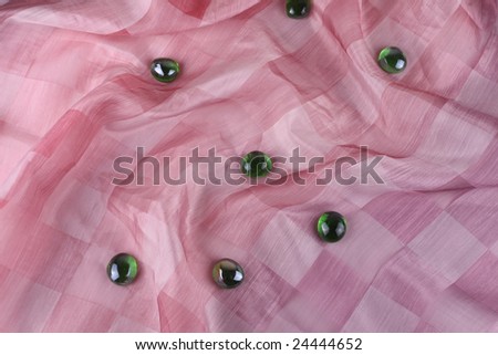 Pink checks background with green pebbles