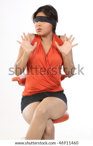 stock photo Young chubby woman sitting on chair with black band tied to 
