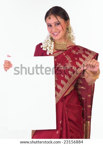  - stock-photo-young-girl-with-red-silk-sari-holding-the-white-board-23156884