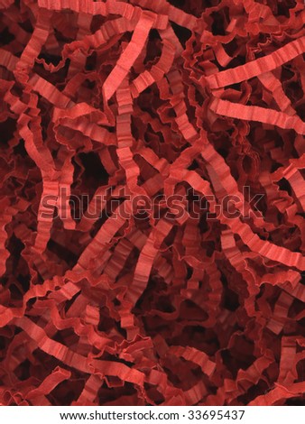 Close up of red packaging cutting paper