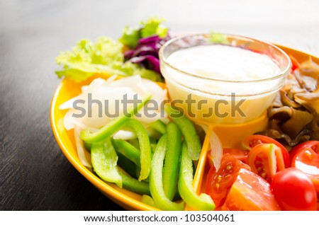 vegetable salad in orange bowl