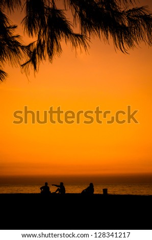 silhouette of a happy family on the beach