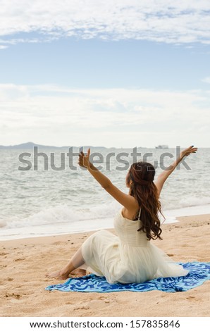 asian lady chilling on the beach