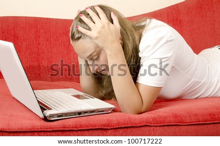 Shot of a woman frustrated with technology and her laptop