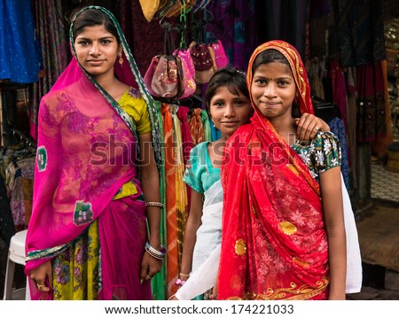 Three girls in the streets of Pushkar, India. Pushkar, India circa May 2013.