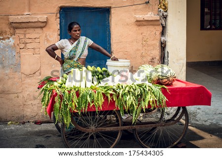 RISHIKESH, INDIA - CIRCA MAY 2013 Woman sells vegetables in the streets of Rishikesh, India.