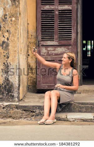 Young traveler woman taking a selfie in foreign city